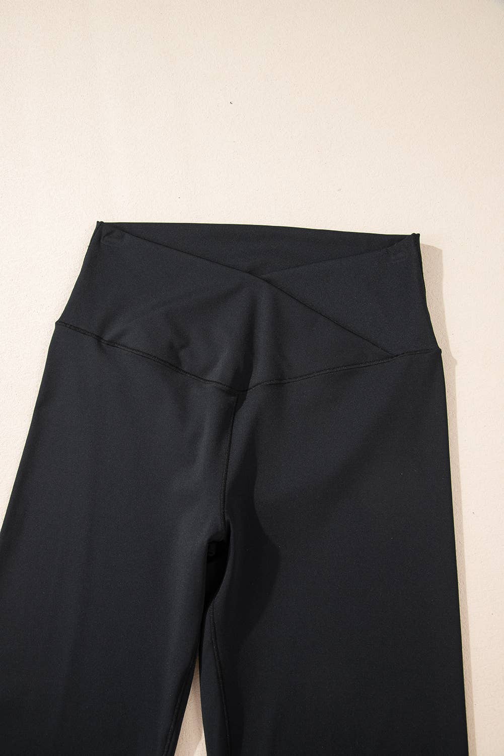 Black pants on a beige background