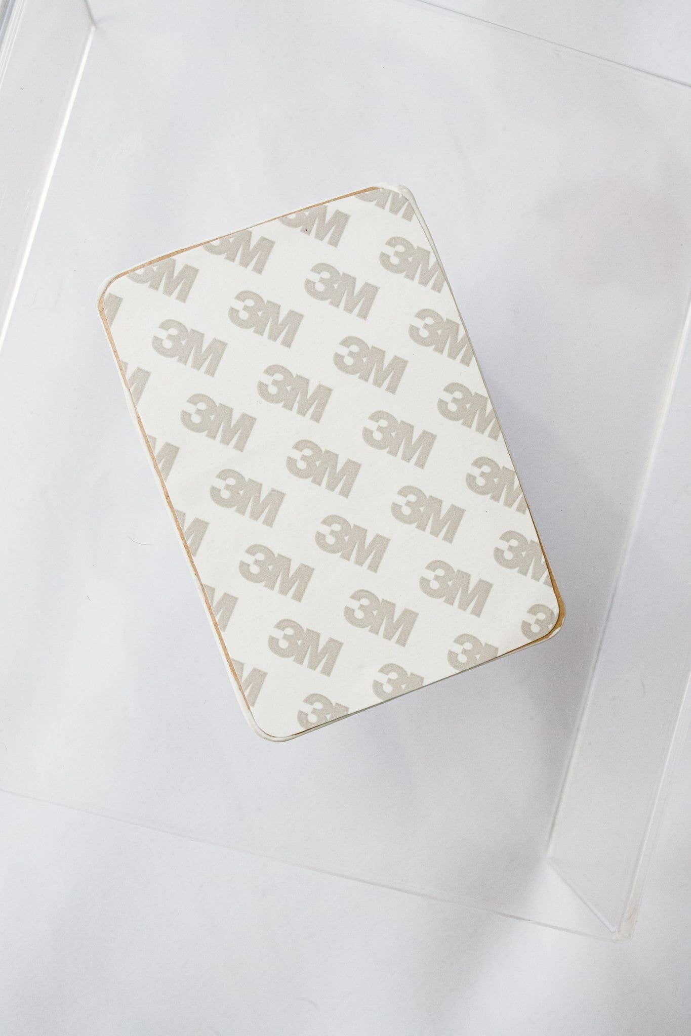Rectangular adhesive patch with '3M' branding on a white background
