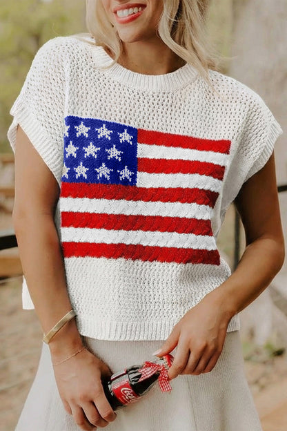 Person wearing a white crochet top with an American flag design.