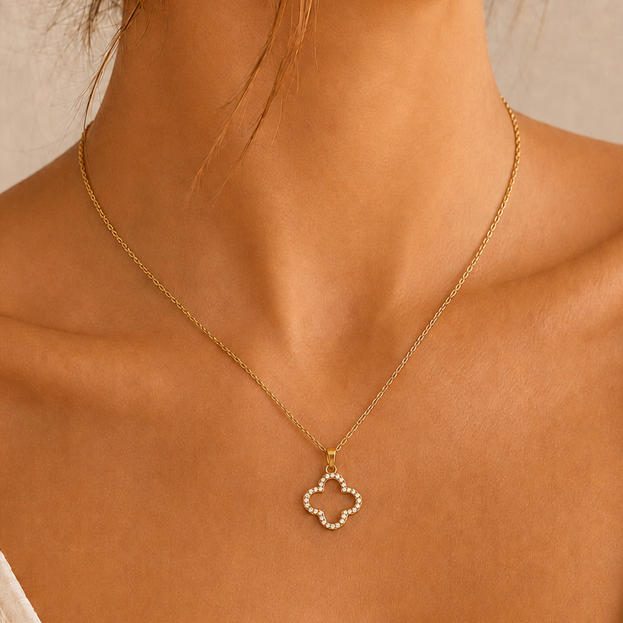 Model wearing the Camille crystal clover pendant necklace in gold
