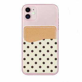 Phone case with polka dot design and beige pocket on a white background
